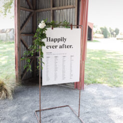 hanging sign board on copper frame in barn