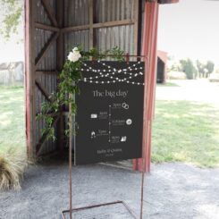 hanging sign board on copper frame in barn