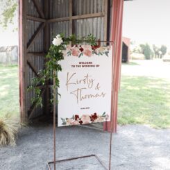 hanging sign board on copper frame in barn